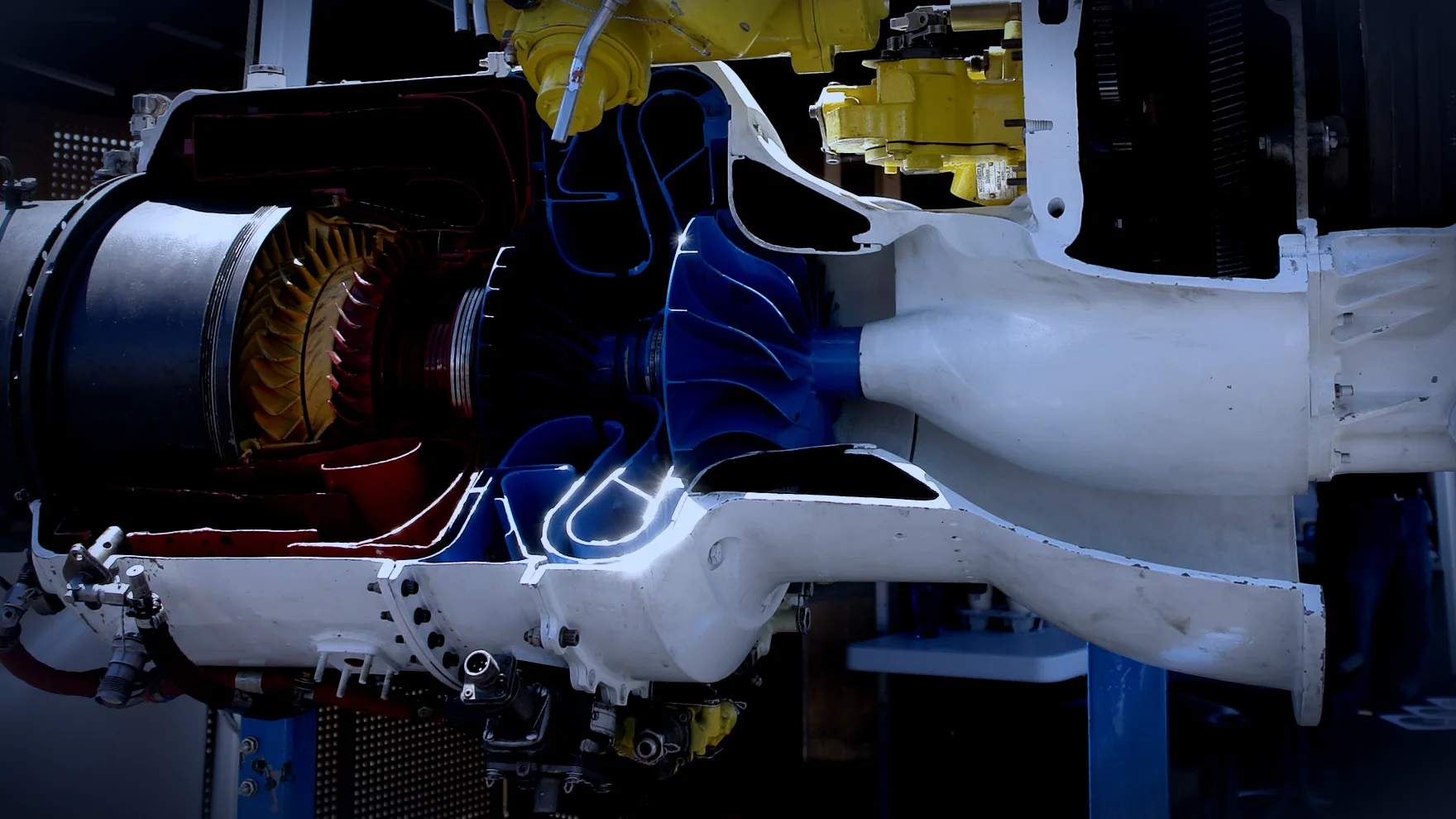 A sectioned turboprop engine, its centrifugal impeller visible in the cut.